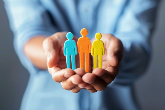 image of hands holding people. helping clients. represents helping brands.